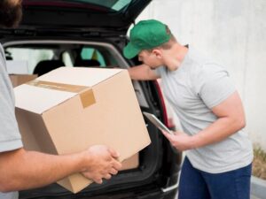close-up-delivery-man-holding-clipboard_23-2148593132[1]